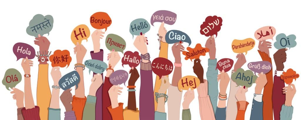 Many arms raised of diverse and multi-ethnic people holding speech bubbles with text -hallo- in various international languages. Diversity people.Racial equality.Sharing and collaboration Health Care Professional standing in modern clinic