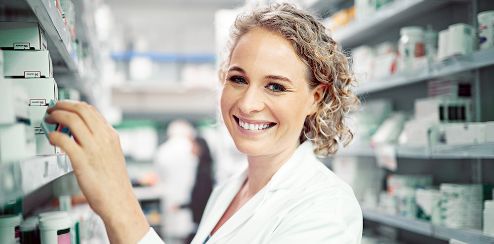 Portrait of pharmacist working in a pharmacy Portrait of pharmacist working in a pharmacy