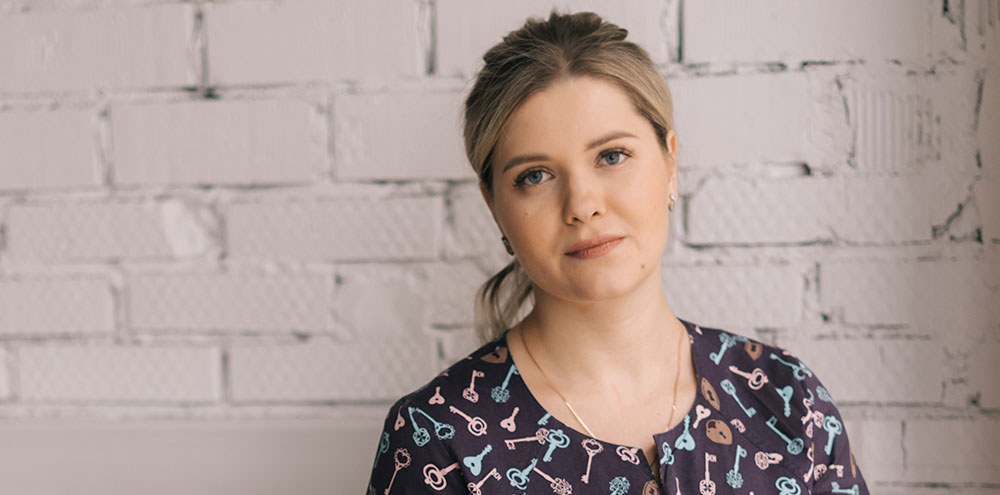 financial-hardship Person standing with wall behind them