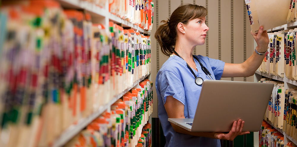 health-record-request-request-for-information Nurse accessing medical records in a secure repository