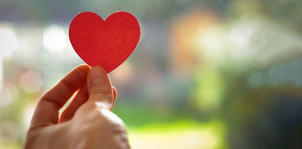 Hand Holding Red Paper Heart Hand holding red paper heart