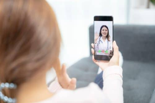 telehealth woman-using-a-phone-for-telehealth